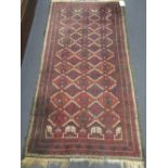 A red ground Beluchi rug, 200 x 103cm