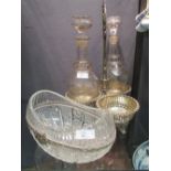 A three bottle EPNS decanter stand decanters (one bottle missing) together with a white metal