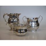 A silver milk jug and two silver sucriers (3)