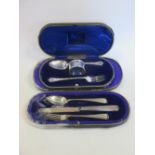 Two cased three piece silver christening sets