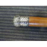 A silver topped cane