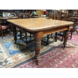 A William IV mahogany extending dining table with two additional leaves, on gadroon moulded and