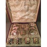 A cased set of six Royal Crown Derby imari pattern coffee cans and saucers