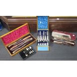 Two sets of cased antler handled carving sets, a Victorian case of silver and mother of pearl