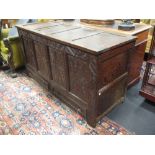 A 17th century carved oak mule chest, 73 x 138 x 54 cm