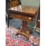 A 19th century mahogany work table on column and quadripartite foot, 74 x 47 x 40 cm