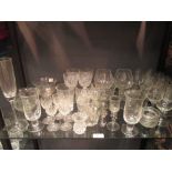 A collection of engraved and cut glass, stoppers, etc