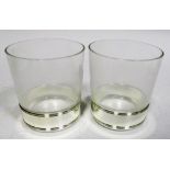 A cased pair of HM Queen Elizabeth II glass whisky tumblers, the EPNS mounted bases engraved with