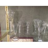A George III air twist wine glass, another similar, a large George III style air twist glass, a