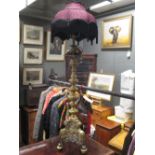 A Dutch brass alter candlestick converted as a lamp, 125cm high