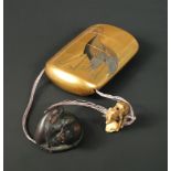 A wooden rat netsuke signed Ikkan (1817-83), an ivory ojime and a lacquer three case inro signed