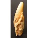 A 19th century tooth netsuke carved as Fukurokuju, the tall headed deity stand holding his rustic