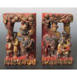 A pair of 19th century temple carvings, pierced and carved in relief with mirror images of