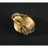 Anraku, a 19th century marine ivory netsuke carved as a quail with inlaid eyes and a stem of