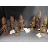 Seven carved wood 'Ibeji' twin figures, Yoruba people, Nigeria, the tallest 30.7cm high (7)