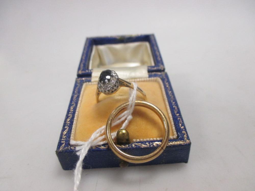 A sapphire and diamond cluster ring, stamped 18ct, cased, together with a 9ct wedding band (3g) (2)