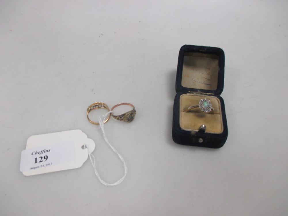 An opal cabochon and seed pearl surround ring, stamped '18ct PLAT' (2.9g), cased together with an
