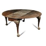 A George II Irish mahogany table, on carved lion mask and foliate carved cabriole legs and hairy paw