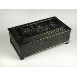 A 19th century Russian cast iron jewellery casket, possibly Tula, the hinged cover cast with putto