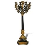 An impressive Empire style slate and ormolu candelabra, the central fruit laden sconce surrounded by