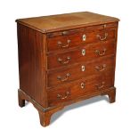 A George III mahogany chest of drawers of small proportions with brushing slide, and four long