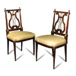 A pair of French Empire salon chairs in the manner of Georges Jacob, with lyre backs and 'Didier'