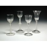 Four various opaque twist wines, the tallest with bell bowl, 17cm (6.75 in), another with a bun knop