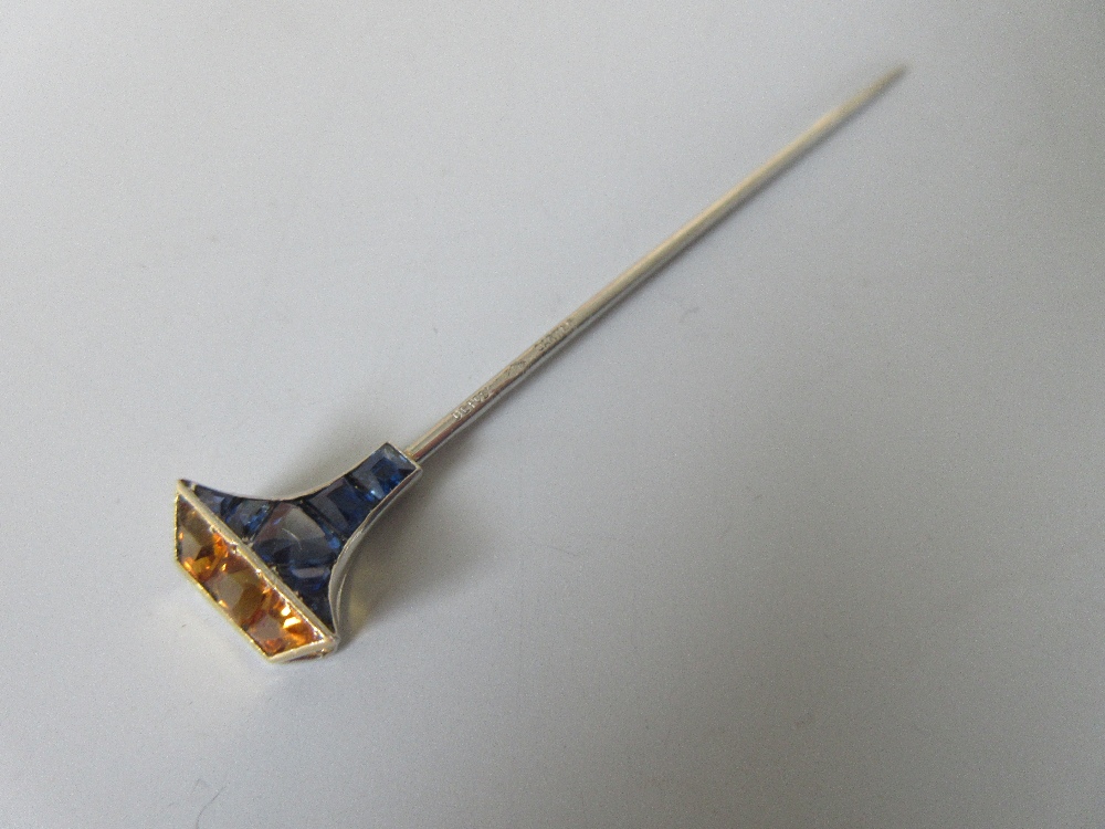 A sapphire and citrine set stick pin by Cartier, designed perhaps as a stylised sport mallet or club