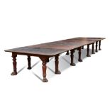 A large Regency mahogany dining table in the manner of Gillow, in four sections with three