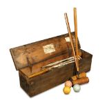 A 1920's croquet set, complete in the original box - lacking pin