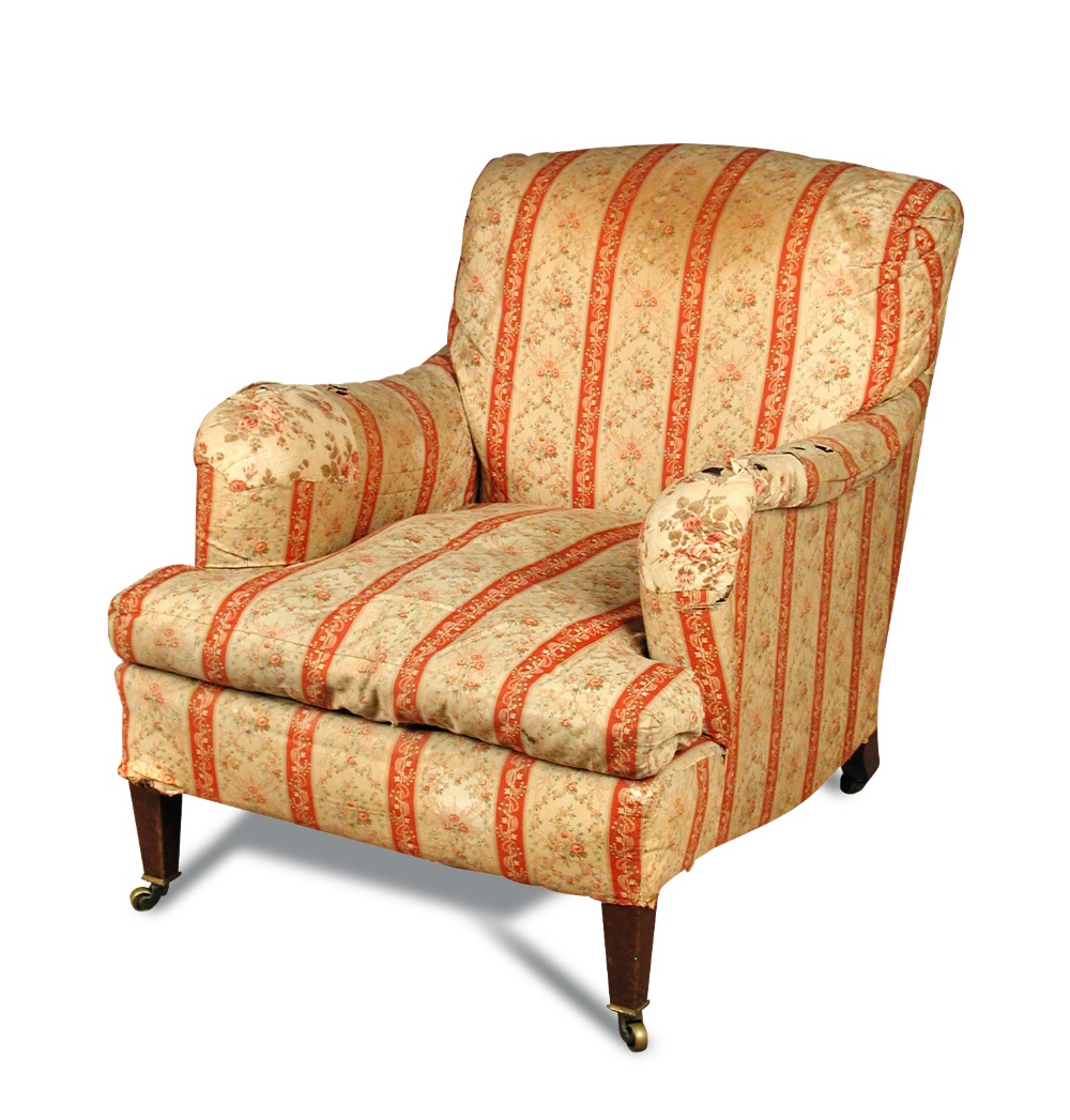 A Howard & Sons upholstered armchair, stamped, Berners Street , no 18098 602, on tapering square