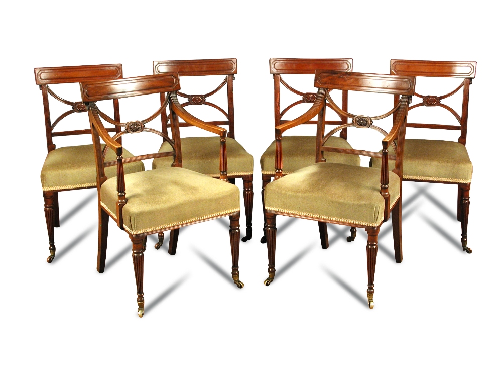 A set of twelve mahogany bar back chairs, with X splats and carved tassel mouldings, on gadroon