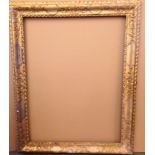 An 18th Century gilt and gesso frame, sight size 116 x 87cm; overall size 144 x 112cm The frame is