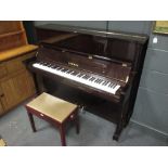 A modern Yamaha upright pianoforte in a mahogany case together with a stool (2)