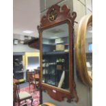 A George III mahogany fret carved mirror, 93cm high