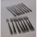 A set of eight fish knives and forks with silver handles