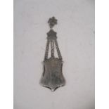 A white metal hanging chatelaine