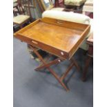 A 19th century mahogany Butlers Tray on a folding stand