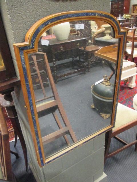 A rounded topped rectangular mirror in 'azurite' inlaid frame