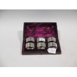 A cased set of six napkin rings, London 1891