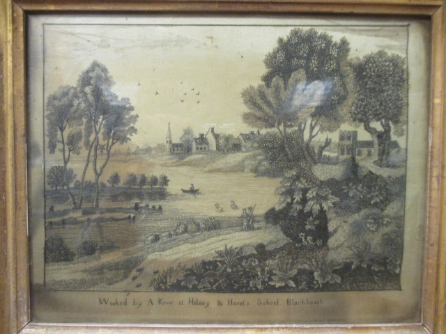 A George III silkwork picture, with a view of a river landscape inscribed 'Worked by A. Row at