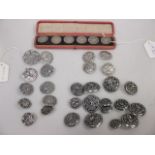 A quantity of silver buttons to include four early 20th century examples with peacock design, a