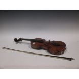 A mid 19th century violin, probably German, traces of a label, some slight damage, cased