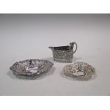 A continental white metal sauce boat, and two bon bon dishes (3)