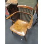 A Victorian ash and elm comb back armchair togeather with a Victorian kitchen chair.