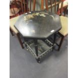 A late Victorian ebonised and painted octagonal occasional table, 55cm wide