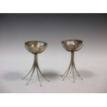 A pair of 20th century hammered metal decorated bowls on stands, makers marks for LFH