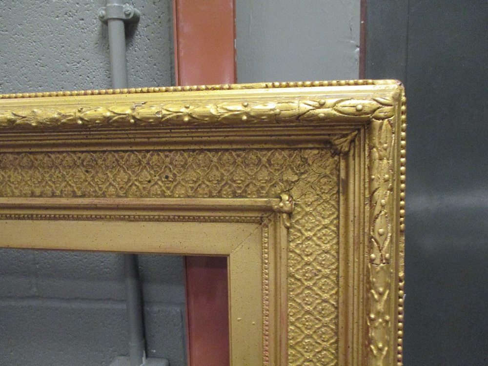 A large 19th century gilt gesso frame, 125 x 167cm (external), 93 x 133cm (aperture)