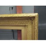 A large 19th century gilt gesso frame, 125 x 167cm (external), 93 x 133cm (aperture)