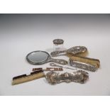 Silver backed dressing table brushes, a hand mirror and glass bottle